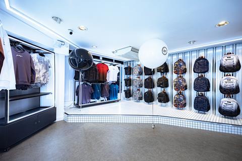 Interior of Hype Carnaby Street store showing T-shirts and rucksacks, decorated with black and white balloons